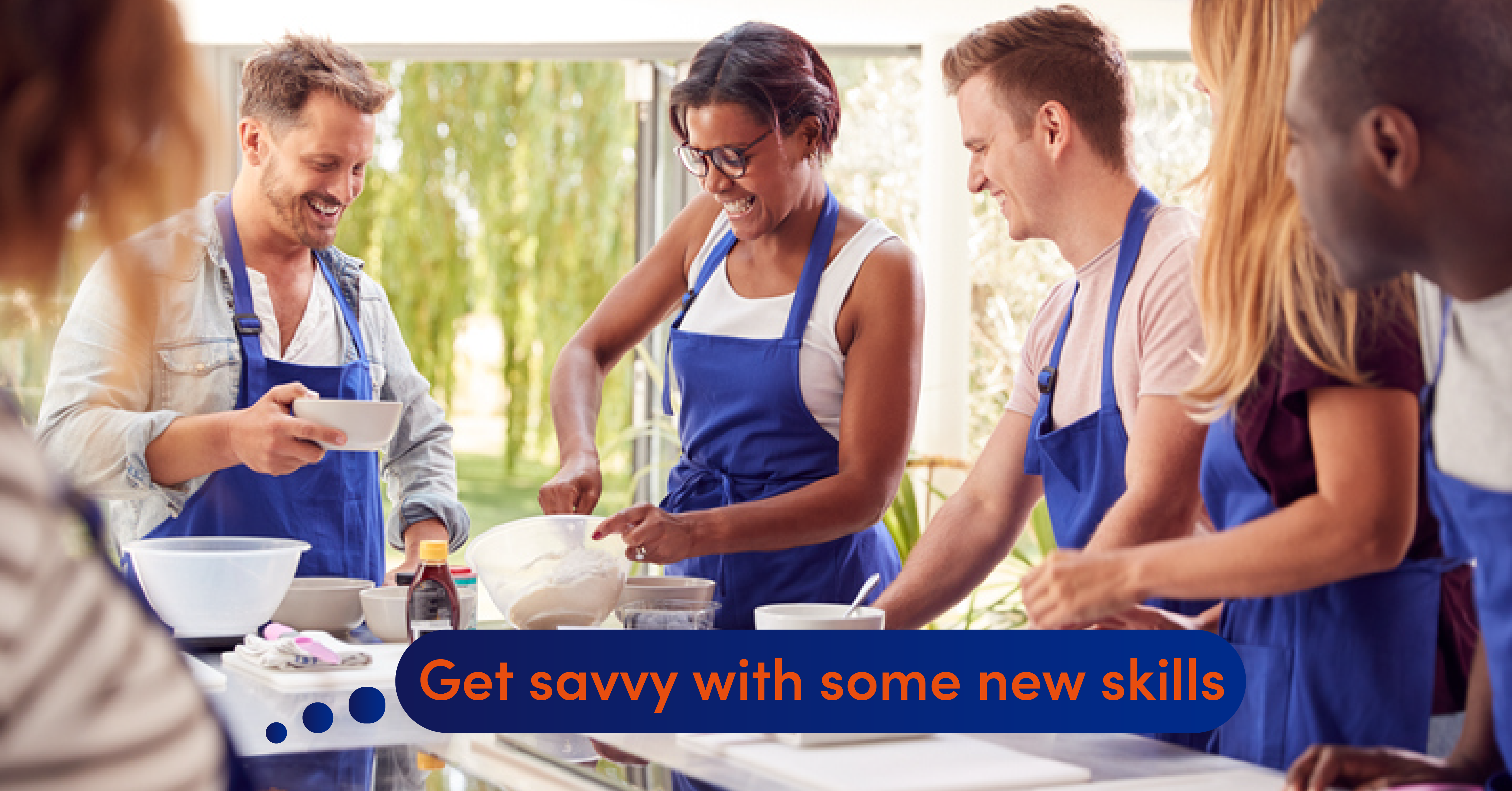 A group of business owners take part in a cookery class to learn new skills