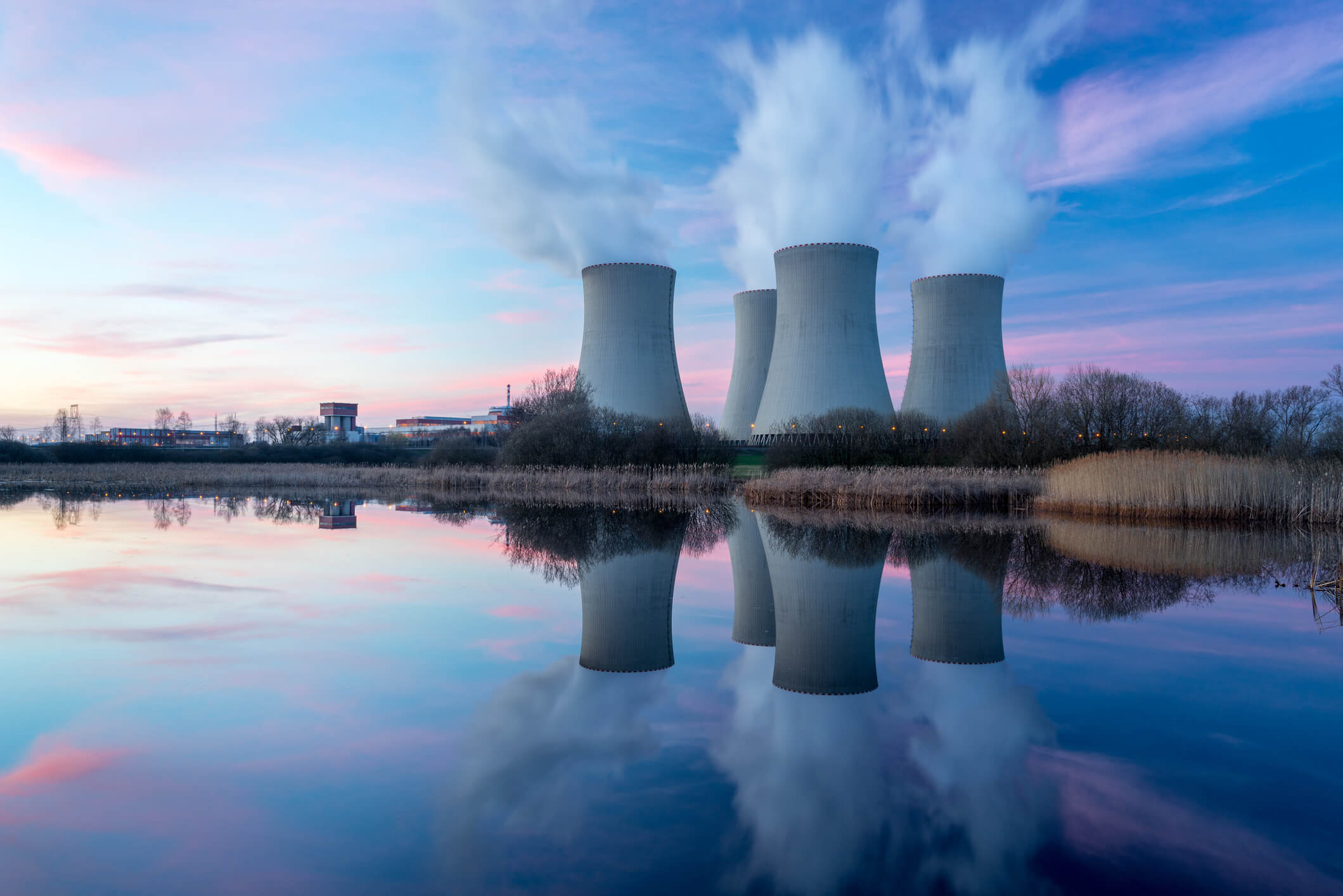 Rural nuclear power plant with lake in front