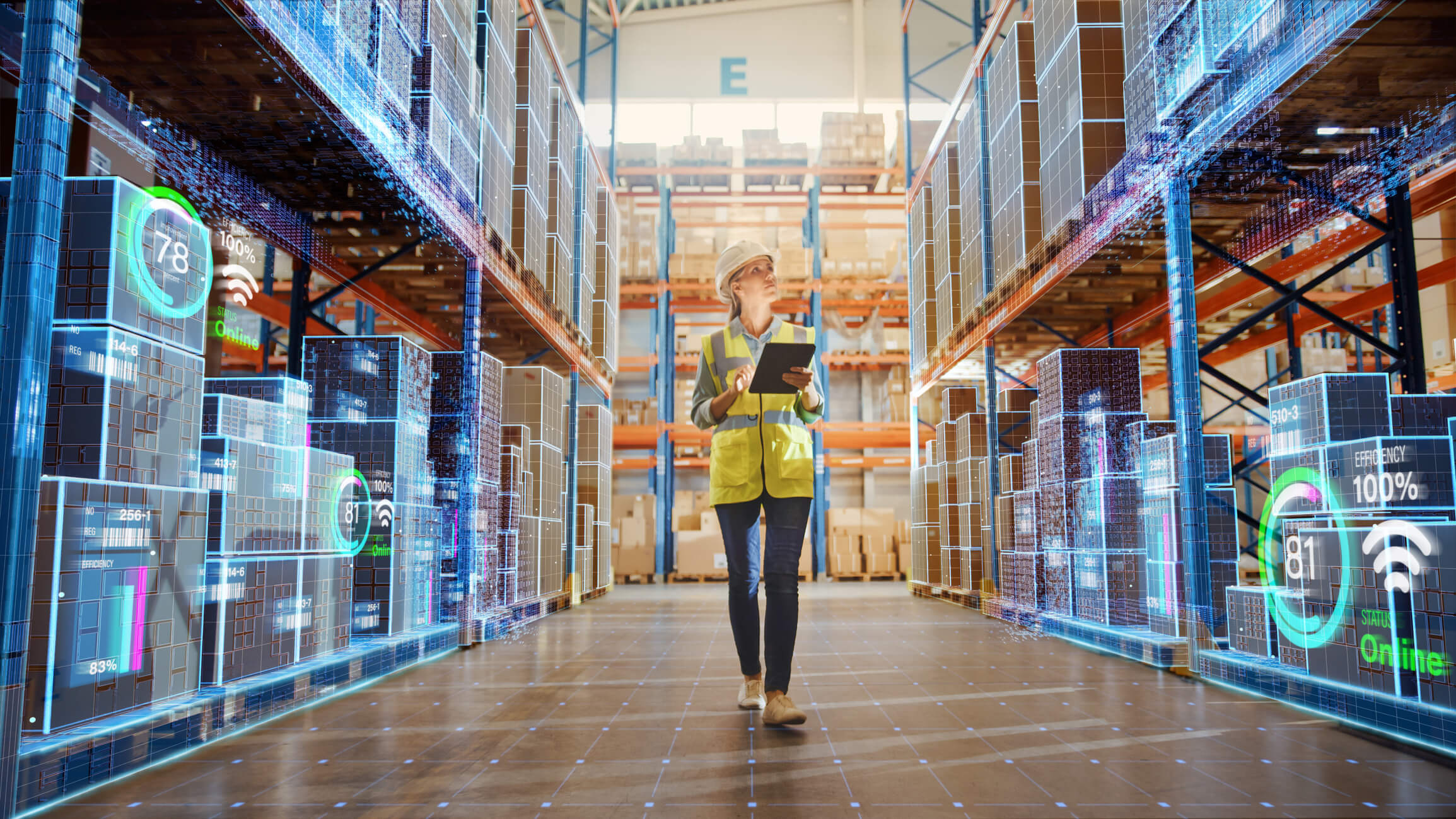 A logistics worker checks holds a tablet to check stock in a warehouse. The Internet of Things could revolutionise insdustries like this.