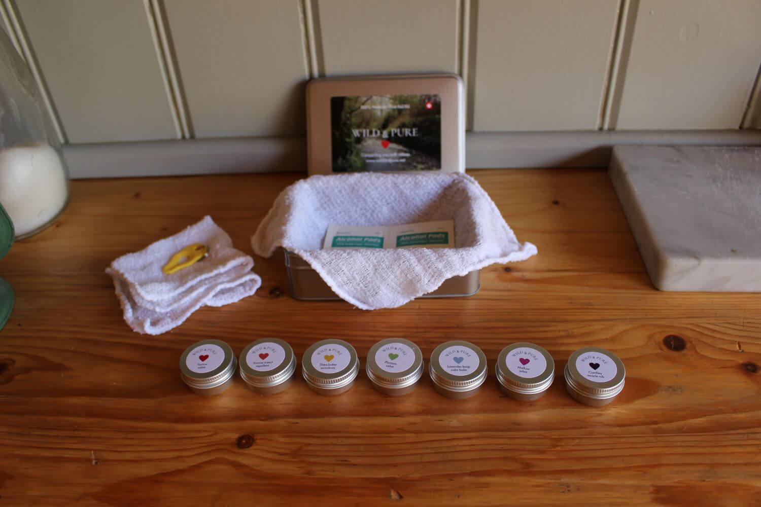 Elaine's natural balms lined up in recyclable tins
