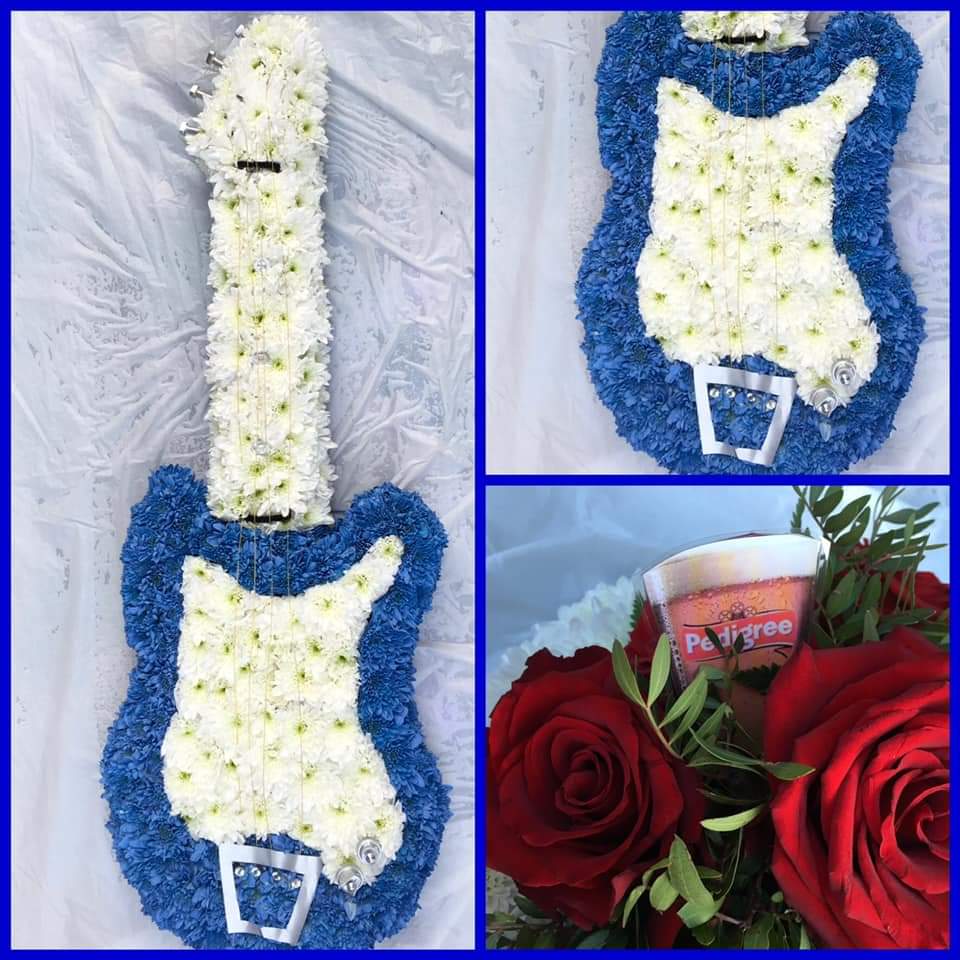 Blue and white floral arrangement in the shape of a guiatr