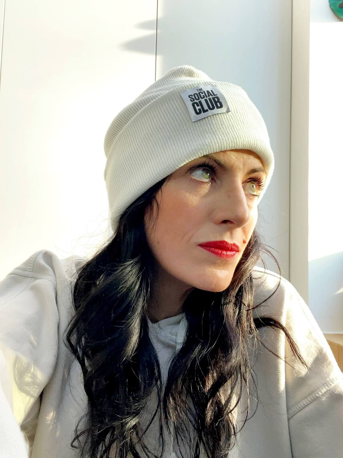 A model wearing one of Jo's white Social Club hats