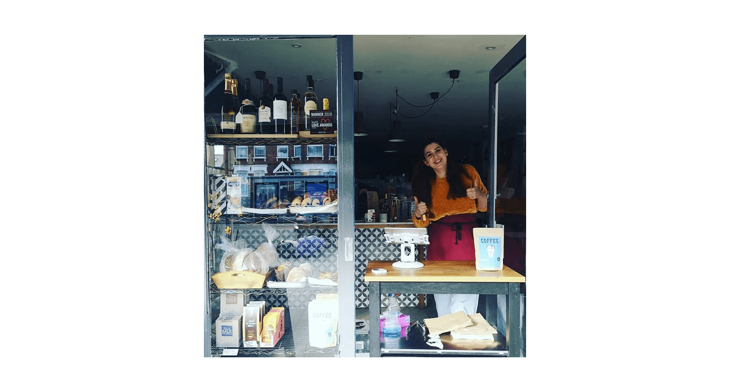 Interior of the Hot Milk Cafe with a counter placed at the door while it operates as a takeaway