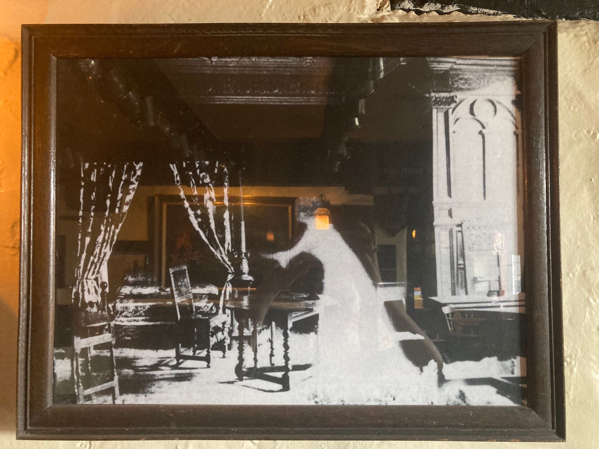 A ghostly figure appears on an old painting 