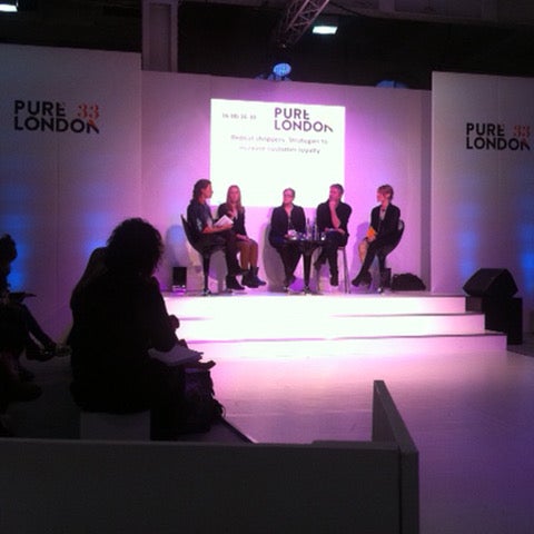 Divine Trash owner Lucy speaking on a panel at the Pure London event