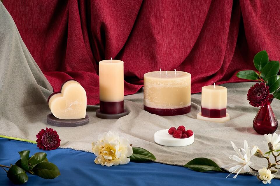 A selection of raspberry inspired white and red candles 