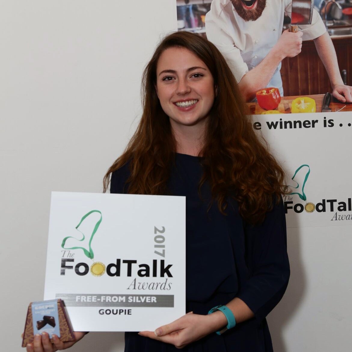Goupie manager Grace Simpson holding her Foodtalk Awards certificate.