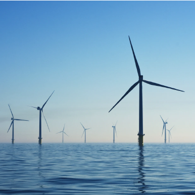 Wind turbines in a wind farm at sea generating renewable energy.