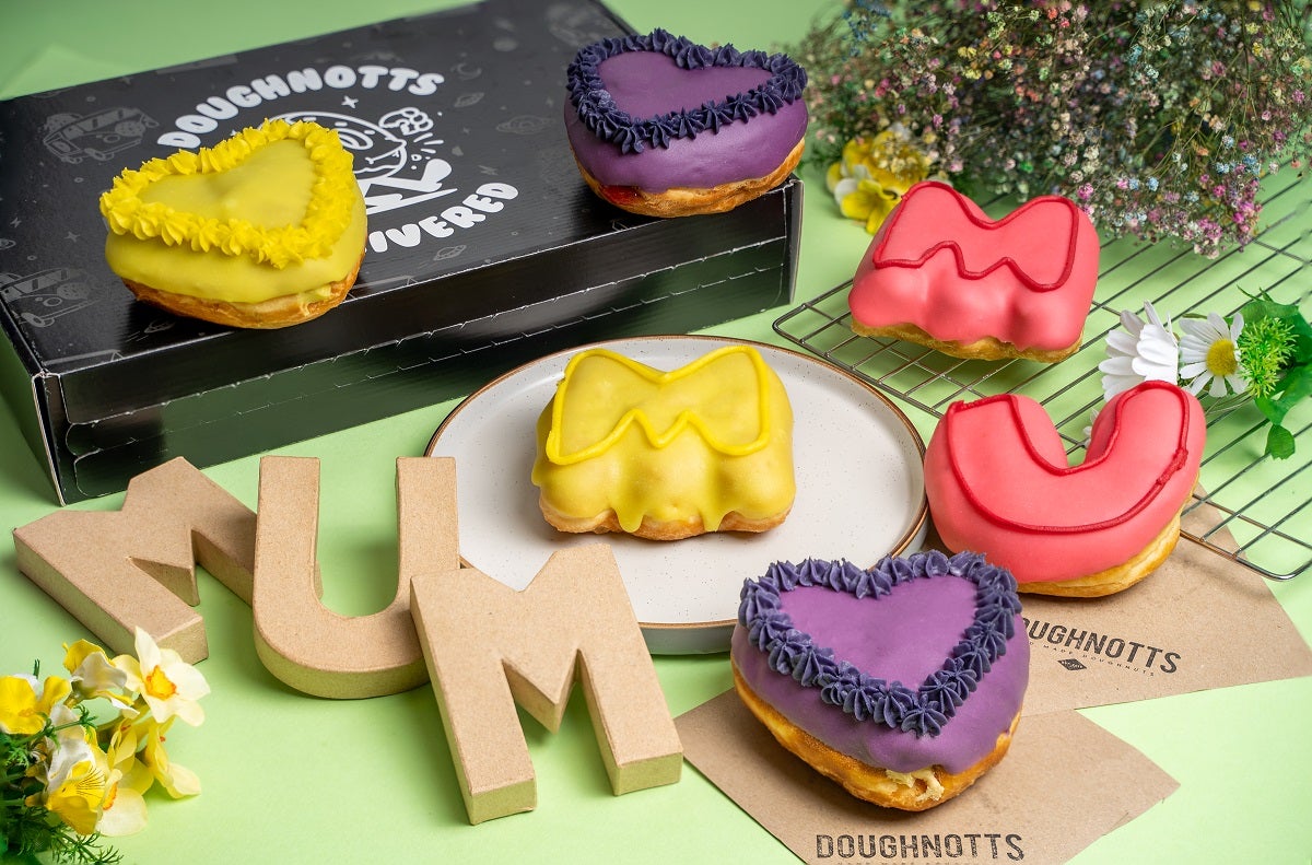 Mother's Day special doughnuts including a bright yellow and purple heart shaped one