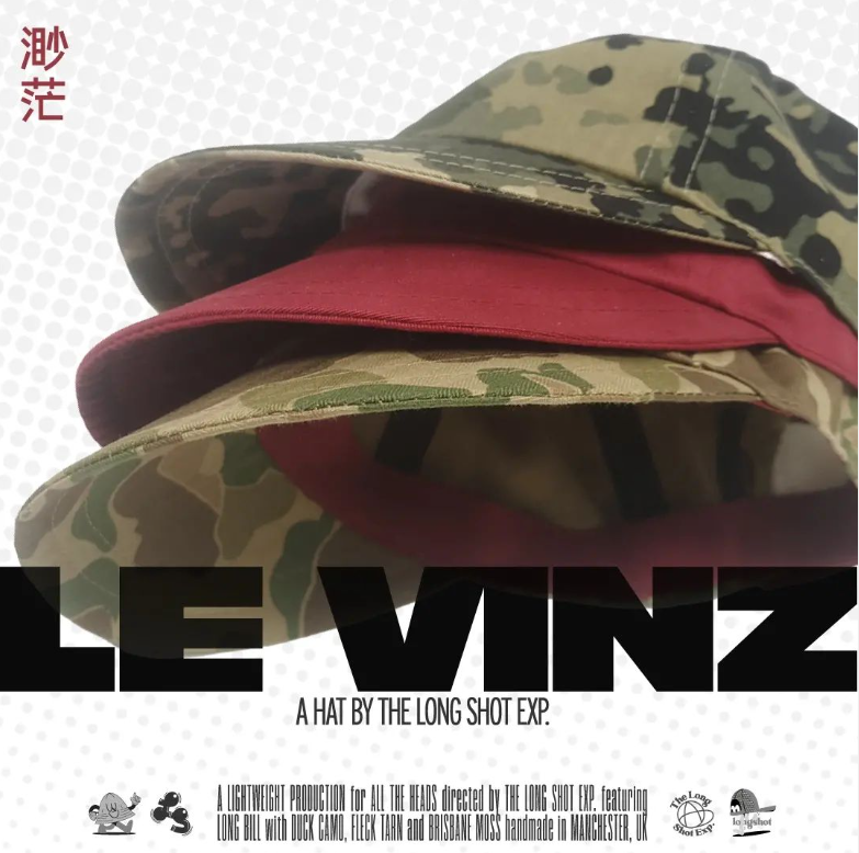 Three Le Vinz caps - two in camo and one in red. The social media post is in the style of a movie poster.