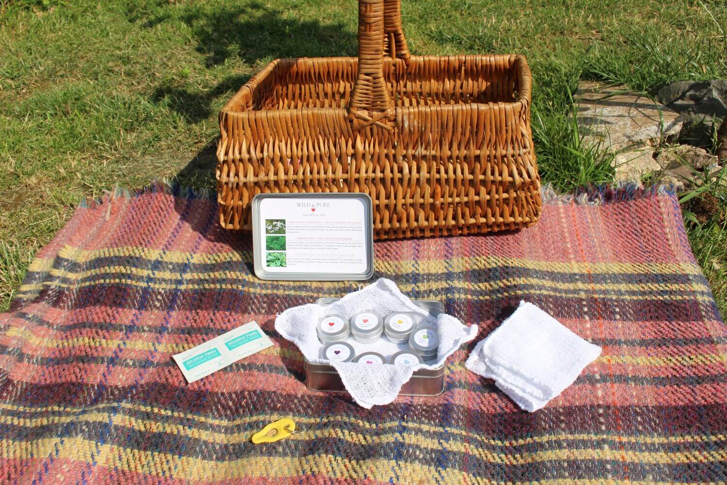 Elaine shows off her natural balms on a picnic blanket 