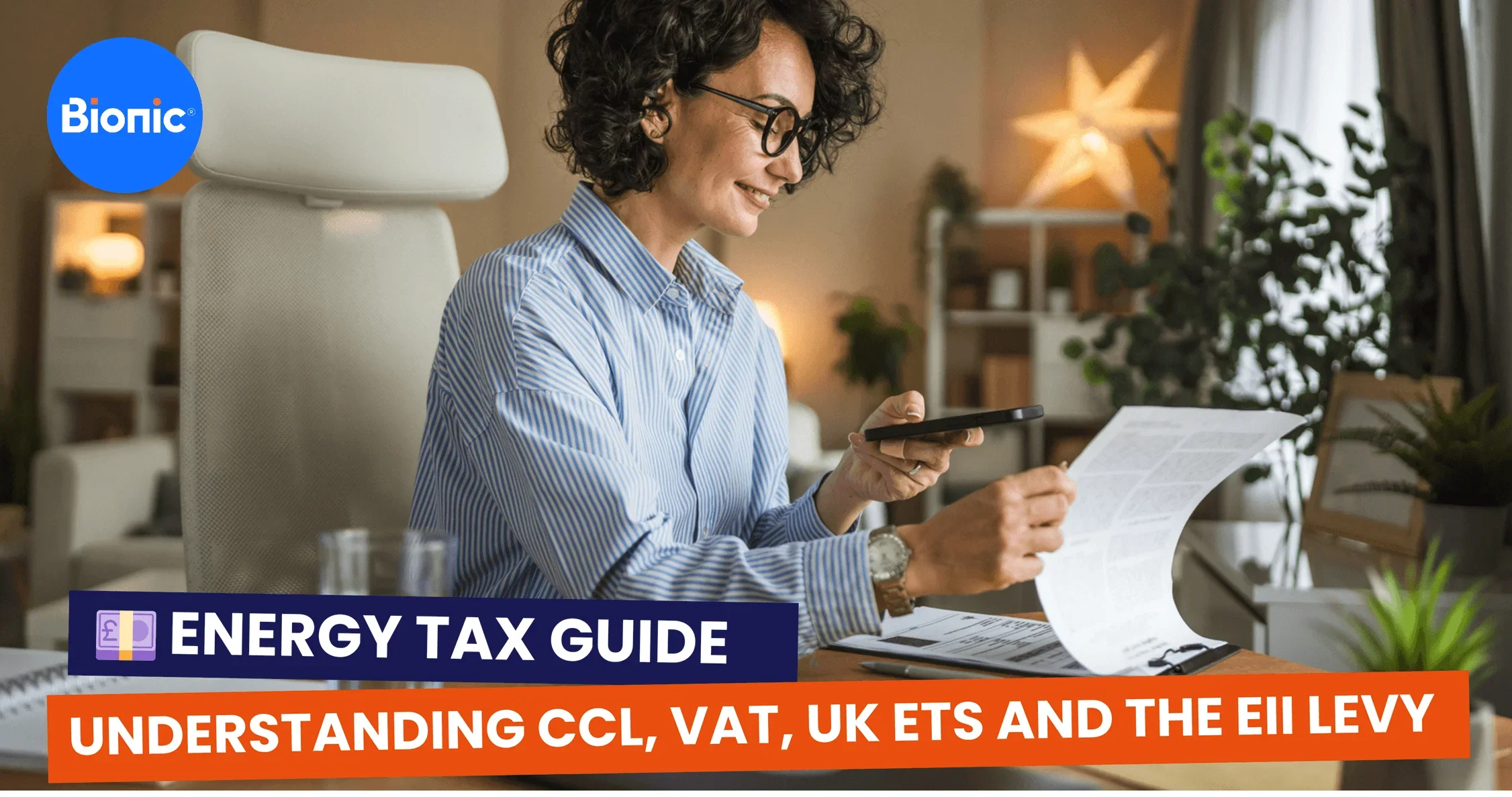 Business owner checks her tax records in her office. The caption reads: Energy tax guide: understanding CCL, VAT, UK ETS and the EII levy