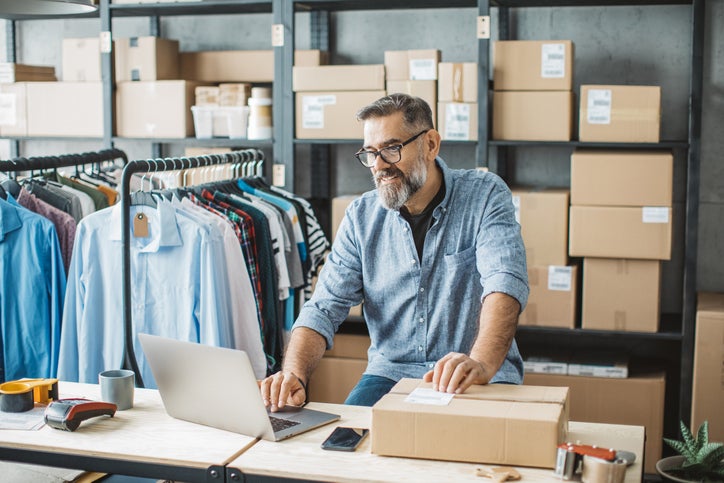 Small business owner packs up and audits his stock as he prepares to sell his business.