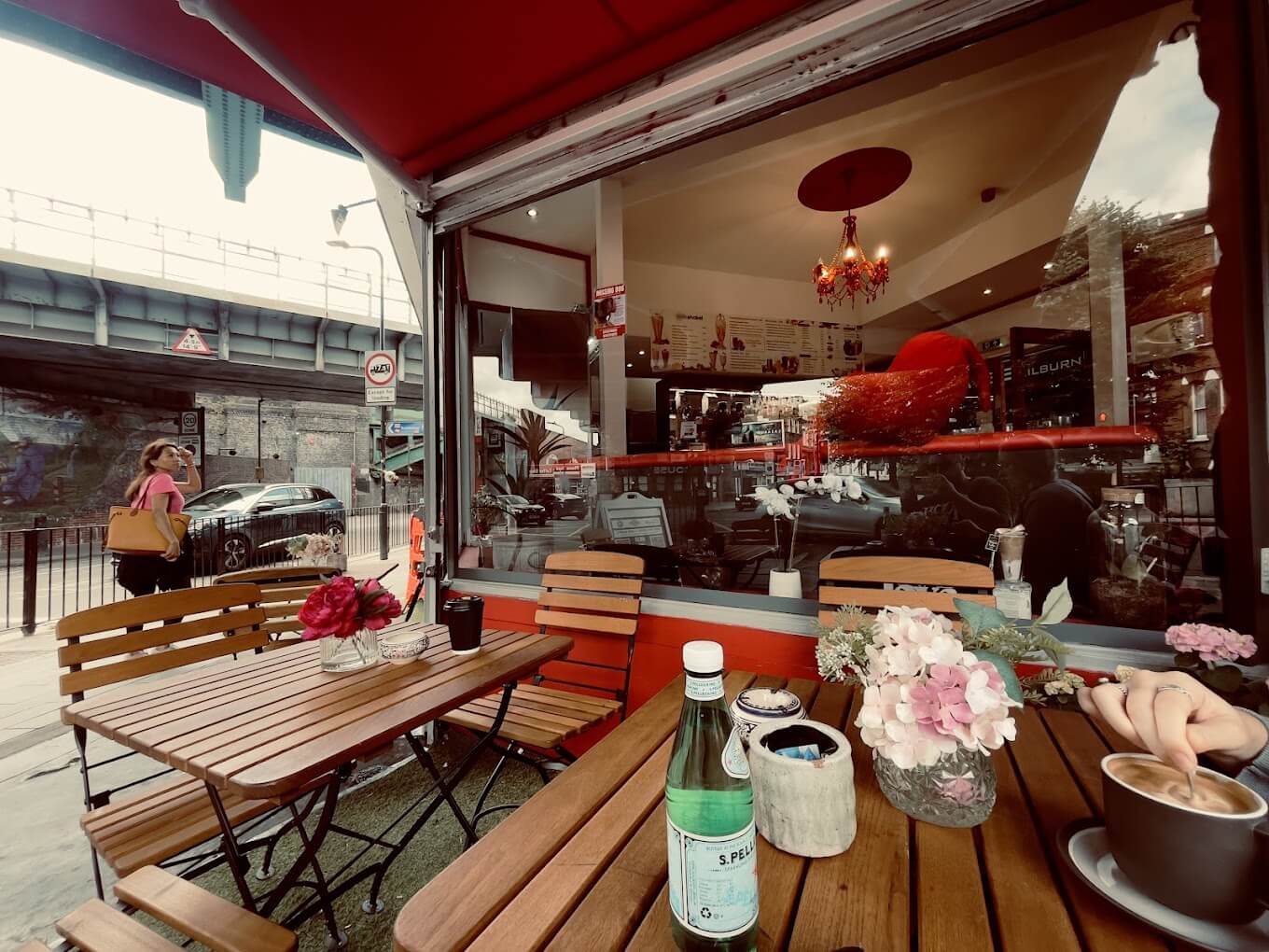 A table and chair outside the Cheerio Juice Bar 