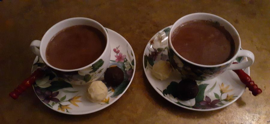 Two servings of hot chocolate in china cups 