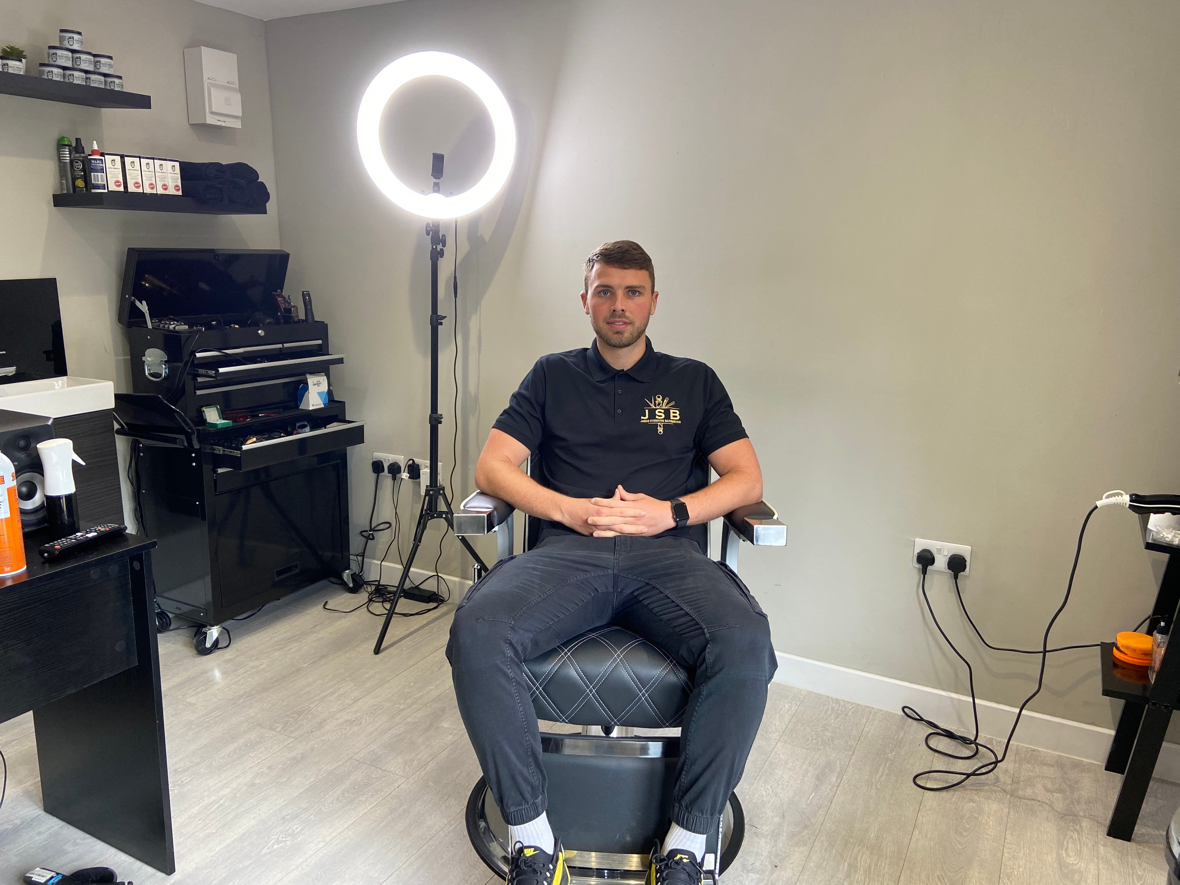 Jamie sitting in his home salon