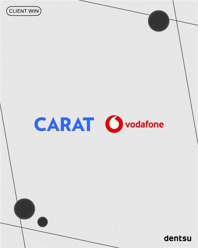 Carat and Vodafone logos on a grey background