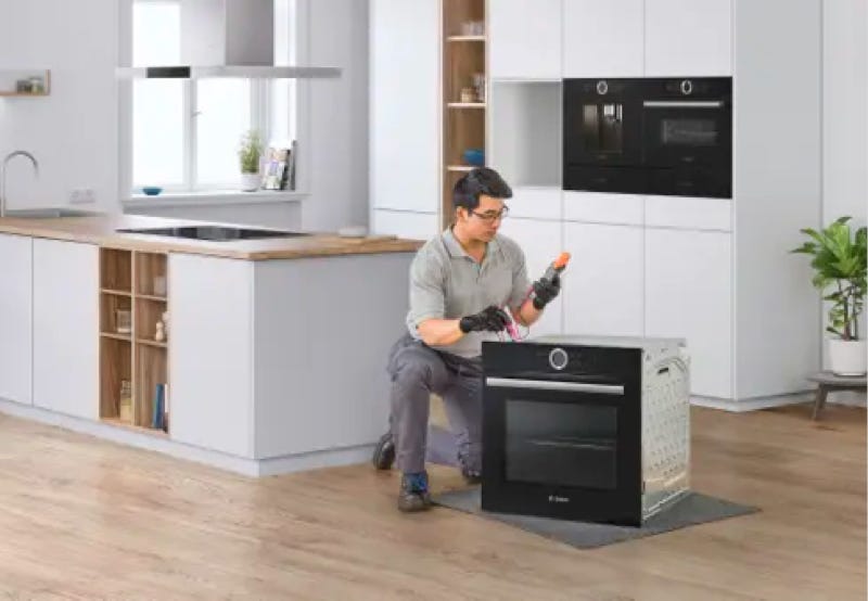 Bosch maintenance engineer installing a new oven