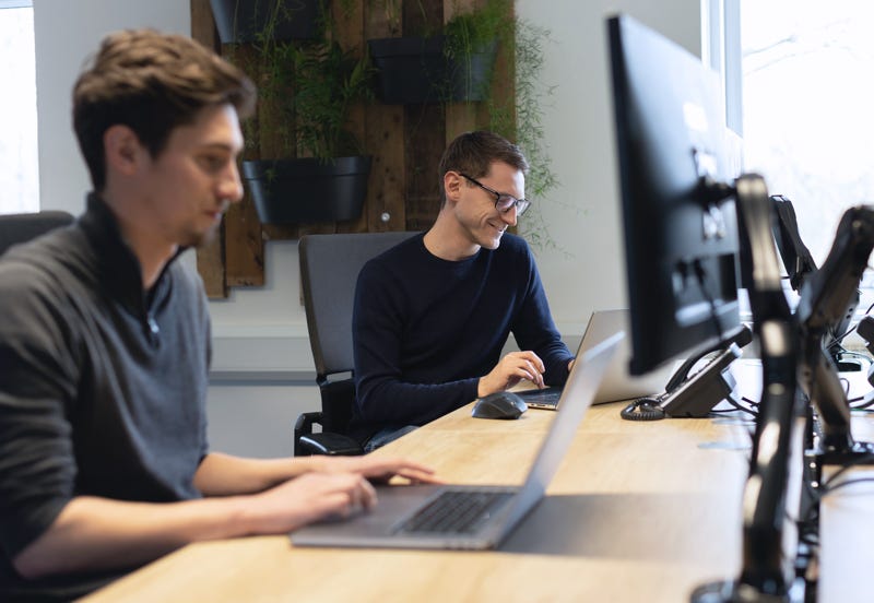 Two Ridgeway Developers using Kentico at their desks