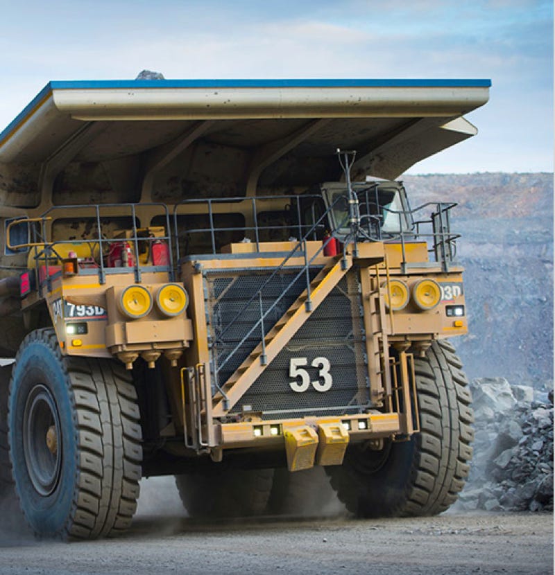 Industrial tipper truck driving through a quarry