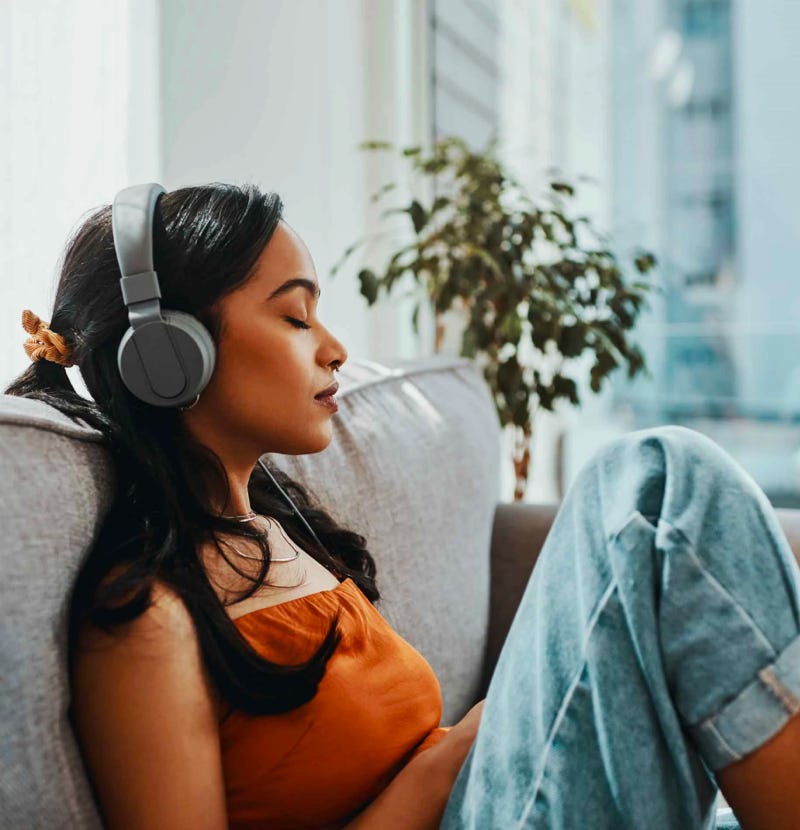 Woman listening to music on headphones