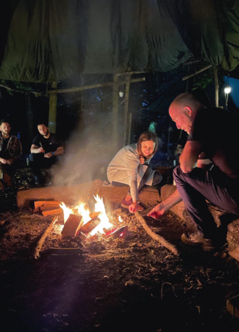Ridgeway team around a log fire