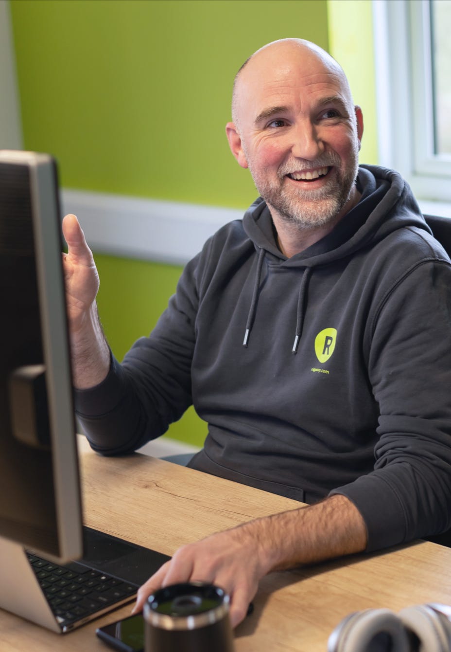 The MD at his desk in a Ridgeway hoody