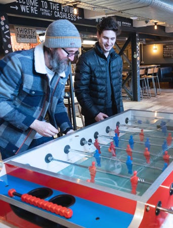 Ridgeway team playing foosball in a pub