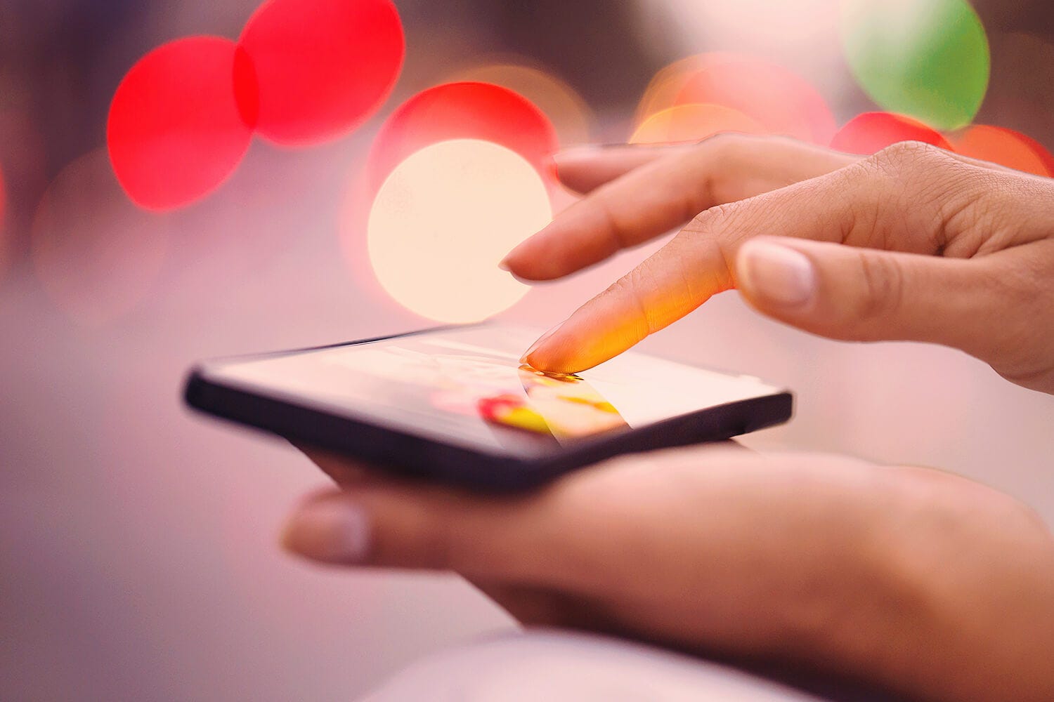 Person's hands using a mobile