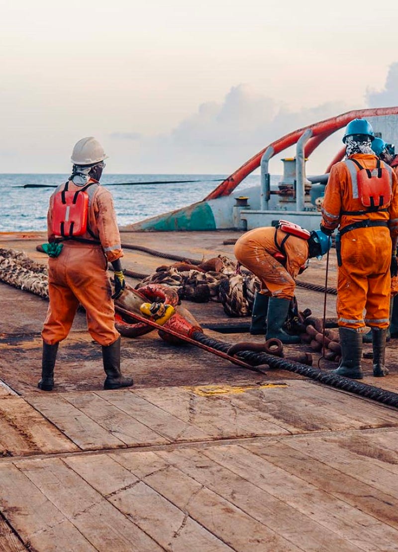 Workers on the deck of a ship