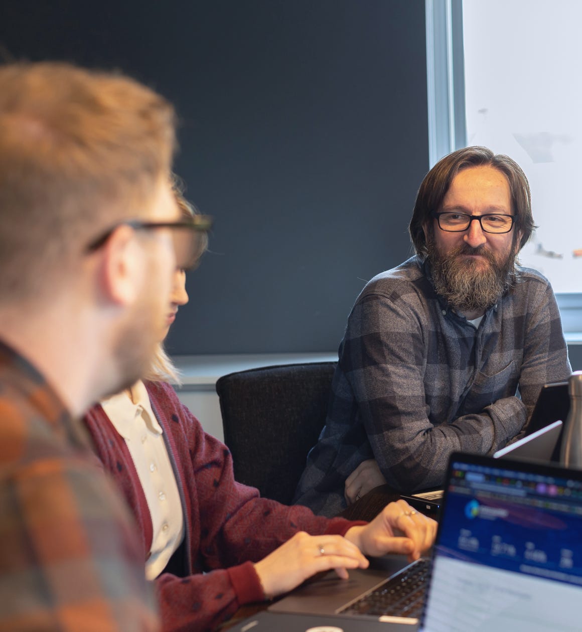Three people in a meeting