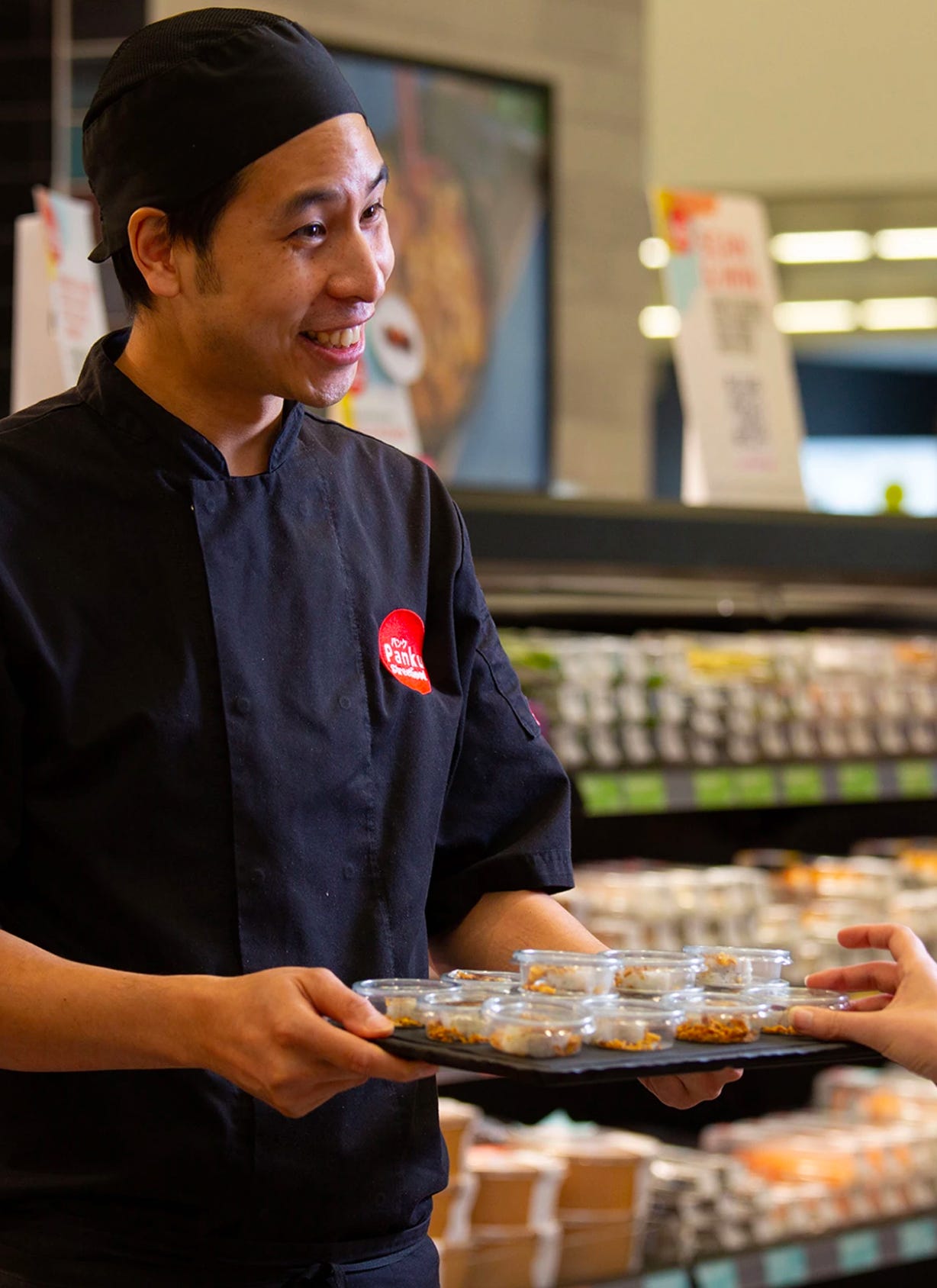 Sushi chef serving sushi