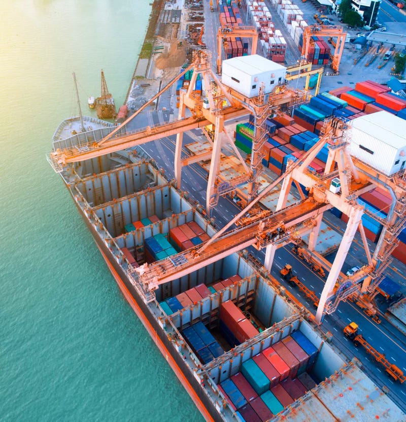 Cargo ship unloading containers at port