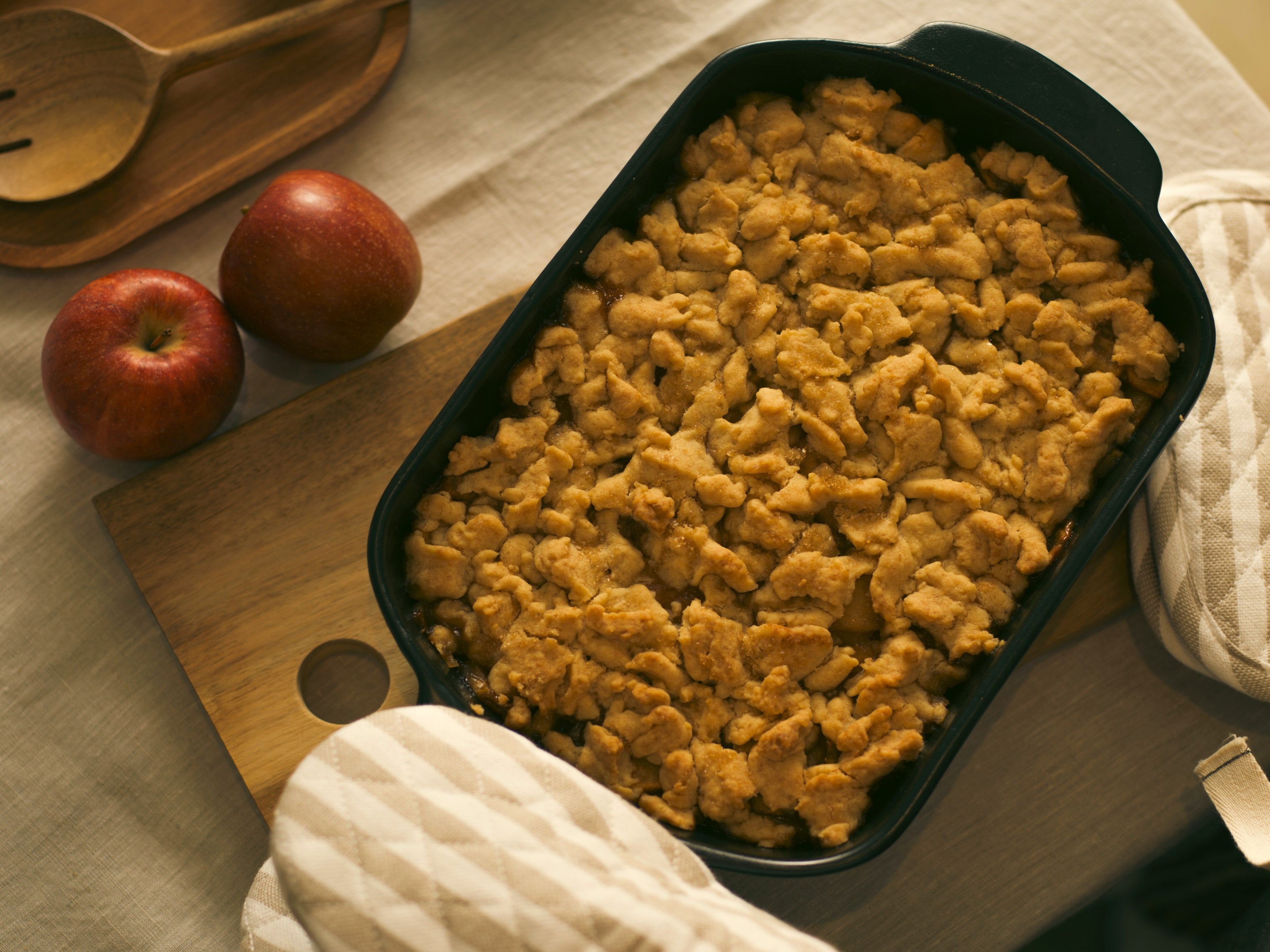 Top view of a Mary Berry apple crumble in a black dish