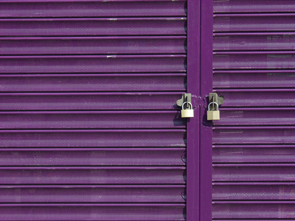 Two Padlocks on Purple Shutters