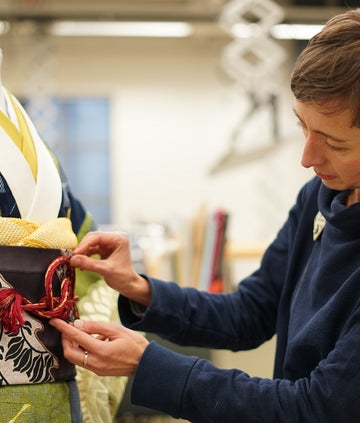 A V&A curator working on a kimono