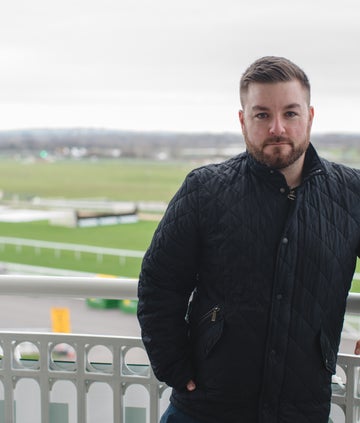 Alex Brooker presenting the NHS: A People's History, a BBC and OU partnership series