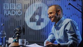 A photograph of a smiling Evan Davis, in the BBC Radio 4 studio.