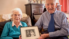 Betty and Eric Tyley pose with their wedding picture