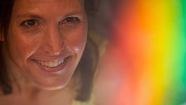 A photo of Helen Czerski and a rainbow-style colour gradient