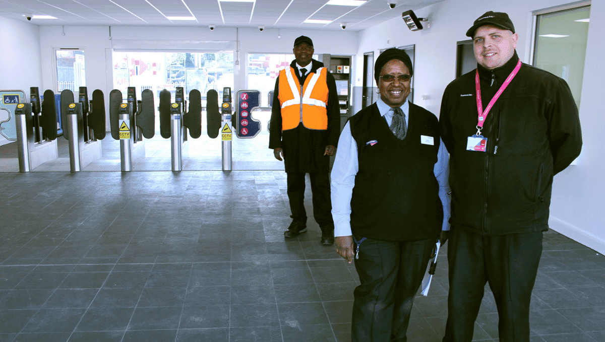 Station staff at gateline Elstree and Borehamwood station. 