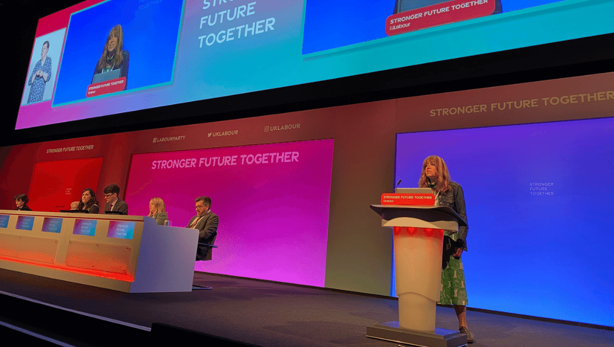 TSSA delegate Fliss Premru speaking from the stage at Labour Conference 2021