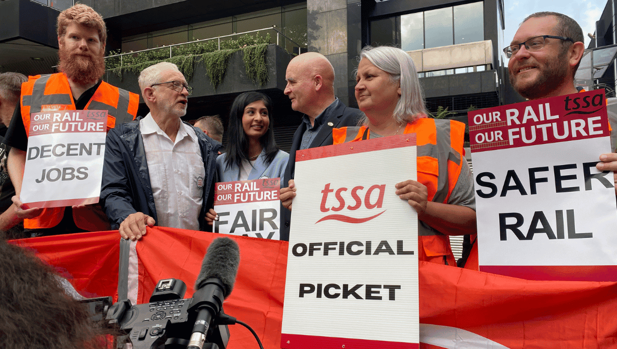 Euston picket with l-r Will Bouisseau, Jeremy Corbyn, Zarah Sultana, Mick Lynch, Josie K, Chris Clark August 2022 with posters and placards