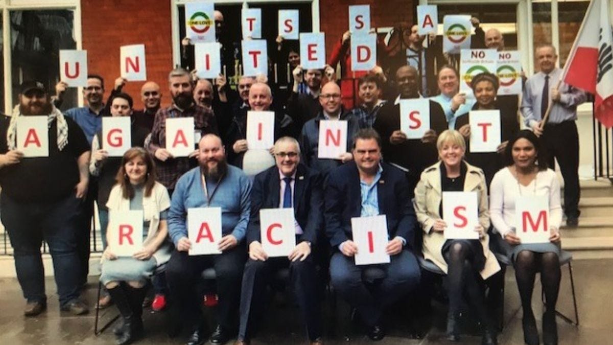 TSSA Executive Committee (EC) group photo with United Against Racism message