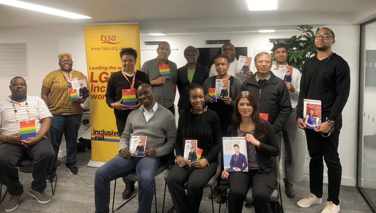 Photo of TSSA Emix group holding Stonewall LGBT meeting materials