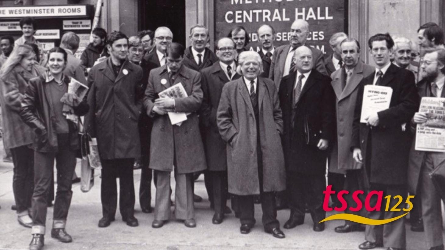 Black and white photo showing group who were part of 2000 rail workers lobbying parliament against Transport Bill in 1981 (With TSSA 125 Logo)