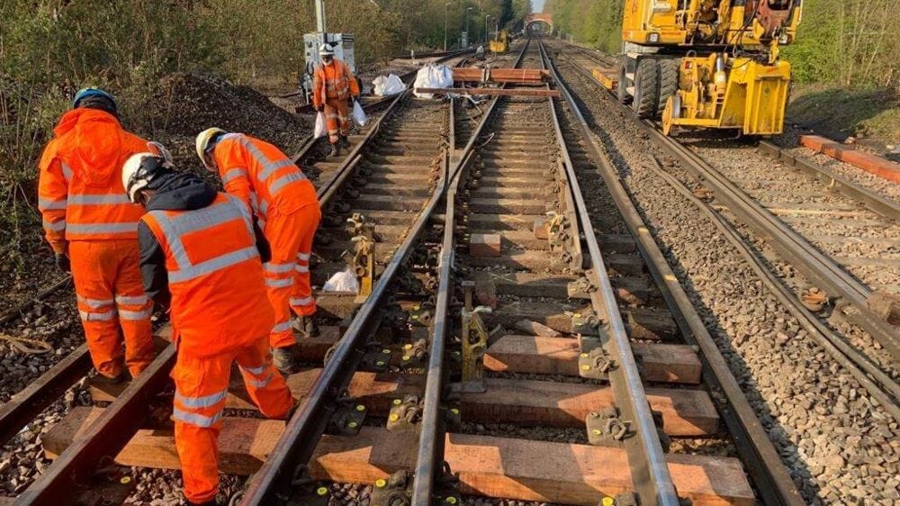 Network Rail engineers in high vis working on tracks