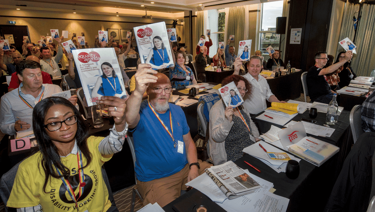 TSSA conference delegates holding up equality agenda booklets