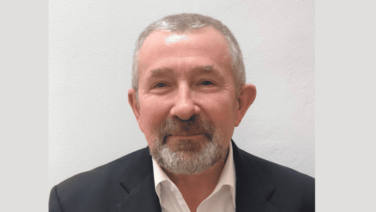 Headshot of Peter Pendle wearing jacket and shirt.