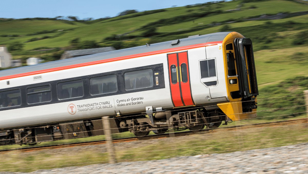Transport for Wales train travelling at speed in countryside